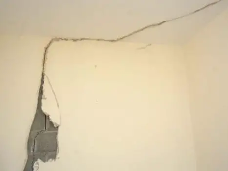 Why do cracks appear in walls and ceilings