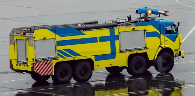 Why Are Airport Fire Trucks Yellow and Not Red?